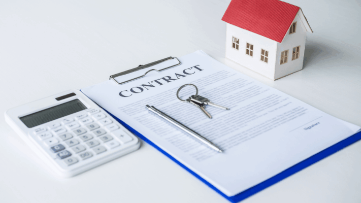 Real estate contract with house model, keys, calculator, and pen representing property analysis and investment planning